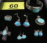 Jewelry Sterling Silver and Turquoise Pieces Sterling silver jewelry with light blue Turquoise stones. Some pieces are Southwestern style.
Cuff bracelet with large inlaid turquoise stone.
Pendant with rope design around large oval shaped turquoise stone.
Ring with cut out design around rectangle shaped stone, size 7.
Cross shaped pendant with cut out design and inlaid oval shaped turquoise.
Drop earrings with light and dark blue turquoise stones.
Earrings with Marcasite and turquoise.
Oval shaped drop earrings with inlaid turquoise.
Total weight: 3.090 ozt.