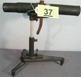 Antique 1930s Mossberg "Spotshot" Scope w/ Stand Vintage 1930s / 1940s O.F. Mossberg & Sons, Inc. Model A "Spotshot" telescope with folding stand, 20x coated lenses. Has some paint and surface wear but lens still focuses well and does not appear to have any damage, leather strap to hold spotting scope in place. Measures 12.75" height x 12.5" length x 1.75" diameter.