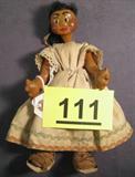 Antique Handmade African-American Doll Vintage crafted black female doll with hand sewn dress and bound leather sandals on feet, no markings of any kind. Body is composed of unknown materials and doll has hand painted facial features, measures about 9" length.
