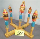Vintage Wooden Pinocchio Ring Toss Toy Darling wooden ring toss Pinocchio game / toy. Hand painted wooden Pinocchio heads are connected to springs and bobble. Measures: 12" tall x 13.5" wide.