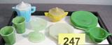 Mixed Lot of Vintage Miniature Toy Glassware Set of 3 miniature octagonal green glass plates / saucers, measure 4.25" across.
Pair of 3.5" diameter small 8-sided plates / saucers, unknown maker.
Miniature light green glass salt dish with figural bunny rabbit lid, measures 2.25" height x 2.5" length x 2" width.
2 small green glasses measures 2" height x 1.75" diameter.
Miniature light blue milk glass pitcher with white lid, has maker stamp on bottom with letter 'A' and bird. Measures 3.25" height x 3.5" length.
Yellow double handled glass sugar dish with tan colored lid, measures 2.5" height x 3.75" across from handle to handle.