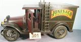 Wooden Decorative Delivery Truck Display Large wooden advertising delivery truck figurine / display / toy.
Truck reads "Jones & Co. We Move Everything", has moving doors and wheels.
Measures: 12" tall x 24" long. Has a few small dings.