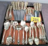 Vintage "Eloquence" Sterling Flatware Set by Lunt Incomplete, vintage sterling silver flatware set "Eloquence" made by Lunt Silversmiths. 
Partial set includes:
8 Individual steak knives w/ bevel stainless steel blades, measure 9.25" long.
8 Modern hollow butter spreaders, with stainless steel blades, measure 6.25" long. 
12 Modern hollow knives, with stainless steel blades, measure 9.75" long. 
12 Dinner forks, measure 8" long. 
13 Individual salad forks, measure 6.5" long. 
7 Place / oval soup spoons, measure 6.5" long.
12 Teaspoons, measure 6" long. 
1 Tablespoon (serving spoon) measures 8.5" long. ]
1 Gravy ladle, measures 6" long.
1 Serving fork / fish fork ?, measures 7.75" long.
1 Pierced tablespoon, serving spoon, measures 8.5 long. 
1 Buffet serving spoon, measures 8" long. 
Total weight: 147.230 ozt.