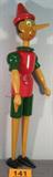 Wooden Pinocchio Doll / Figurine Darling wooden Pinocchio doll figurine. Hand painted doll with moving limbs, doll is held together with internal elastic bungee like band. Has interchangeable nose pieces, one large and one small. Has original sticker "Giocattoli Galetti" made in Milano Italy. Measures 26" tall.