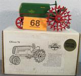 Farm Toy Signed J. Ertl "Oliver 70" Model Tractor 1:16 scale die cast Heritage Line Special Edition Oliver "70 Row Crop" toy model tractor, made by the Ertl Company. Hand signed on seat by Joseph L. Ertl, comes with matching box. No extra parts or papers, in great condition. Has been previously displayed outside of box in a smoke and pet free home.