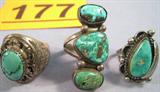 Jewelry Lot of 3 Sterling Silver & Turquoise Rings Heavy Sterling Silver men's ring with oval cut and polished Turquoise stone in razor tooth setting, size 9.
Size 9.5 Sterling ring with three polished Turquoise stones set in line across front, no markings of any kind.
Southwestern style Sterling Silver ring with teardrop shaped Turquoise stone, size 7.75.
Total Weight: 40.2 grams / 1.290 ozt