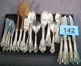 Wallace Sterling Silver Flatware Pieces "Baroque" Beautiful Wallace sterling silver flatware pieces, pattern is "Baroque".
Partial set includes:
6 Modern hollow dinner knives with stainless steel blades, measure 9.75" long.
6 Teaspoons, measure 6" long.
2 Round bowl soup spoons, measure 6" long.
4 Tablespoons, measure 7" long.
6 Dinner forks, measure 8" long.
1 Flat handle butter spreader, measures 6.25" long.
1 Serving spoon, measures 8.75" long.
1 Sugar shell spoon, measures 6.25" long.
6 Salad / Dessert forks, measure 6.5" long.
6 Butter spreaders with stainless steel blades, measure 6" long.
Salad serving spoon and fork with wooden tines, measures 11" long.
Total weight: 79.650 ozt.
Knives and salad servers separately weigh: 32.895 ozt.