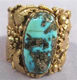 Jewelry 14k Gold & Turquoise Southwestern Ring Unbelievable 14kt yellow gold southwestern style men's ring with large Turquoise stone. Band has a beautiful intricate design with flowers and leaves.
Ring size: 14, total weight: 18.3 dwt.