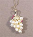 Jewelry 14k Gold Ruby Pearl Grape Cluster Necklace Lovely and unusual necklace with "Grape Cluster" pendant made of freshwater pearls and rubies. Three round brilliant cut rubies approx .03 ctw. Chain measures 18" long. Pendant measures 1.25" long. Both pieces are marked 14k.
Total weight is 2.3 dwt.