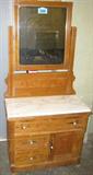 Furniture Antique White Marble Top Dresser Vintage wooden dresser with large swiveling mirror, large drawer on top, two small drawers and cabinet on bottom. Made by Cline & Whelden, marked on inside of largest pull-out drawer. Missing locks and edges show usual signs of age, some surface wear. Measures 69" height x 33" length x 18" width.