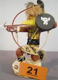 Brown Buffalo Kachina Signed Dine' Signed by the Artist. Titled: Brown Buffalo Warrior. Measures 10" tall. Has the history and information written on the bottom of the base
