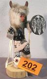 Grey Wolf Warrior Kachina Signed Dine' Titled Grey Wolf Warrior Kachina. Signed by the Artist. Measures 10" Tall. Has the History and information written on the bottom of the base.