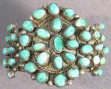 Jewelry Native American Turquoise Bracelet A beautiful Turquoise and Silver Bracelet. Unsigned but very high quality. Has several polished Turquoise stones. Measures 2.5" wide and over 4" across.