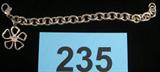 Sterling Silver Tiffany & Co Bracelet Tiffany & Company sterling silver bracelet with flower shaped charm and lobster claw clasp, stamped "Tiffany & Co 925". Measures 7" length.
Total Weight: 34.3 grams / 1.105 ozt