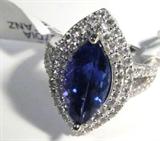 Jewelry 14kt White Gold Marquis Tanzanite Ring
Elegant 14kt white gold Tanzanite and Diamond ring. Size: 7.25.
Included AIG Pre-Sale Estimated Retail & Gemological report reads:
"One electronically tested 14kt white gold ladies cast Tanzanite and diamond ring with a bright polish finish. Condition is new, good workmanship. The featured Tanzanite is set within a two tiered diamond lattice gallery, supported by diamond set split shoulders and completed by a two millimeter wide band. Trademark is RT. Identified with markings of "14k". Containing:
One prong set marquis mixed cut natural Tanzanite, measuring 15.00 x 7.30 x 5.55mm, approximate weight of 3.80ct., clarity is eye clean, type 1, medium dark, moderately strong, bluish violet color, (GIA bV 6/4) to medium dark, moderately strong, violetish blue, (GIA vB 6/4), cut is good. Transmitting light with no distortion, transparent. The stone displays 40% extinction. Graded in the setting. 

Tanzanite is a very rare gemstone that is only fo