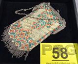 Vintage Art Deco Mandalian Mfg. Metal Mesh Purse
A gorgeous vintage metal mesh and enamel purse. The frame is signed "Mandalian Mfg Co". The purse has an orange and green pattern on a gold background with metal fringe at the bottom. Shows some signs of wear from age and use. Measures approximately 6.5" long.
