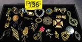 Jewelry Mixed Lot Costume Pins & Brooches
A beautiful lot of vintage pins and brooches. Christmas is just around the corner and some of these would make lovely gifts. A sampling of this lot is:
 - Gold tone filigree pin with an iridescent blue middle stone and accented with small pearl like settings.
 - A very nice gold tone pin with painted metal roses and a single aquamarine color stone setting.
 - Heart shaped brooch with pastel flower decorations.
 - Vintage multi layer silver tone pin adorned with amber colored stones.
 - Gold tone ribbon shaped brooch with a small black and white cameo decoration in the center.
 - Many more items.