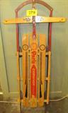 Vintage Paris Champion Fastback Snow Sled
A vintage metal runner wooden snow sled. This Paris Champion Fastback sled has a floating steering mechanism. The guide rope is missing and the rest of the sled shows signs of wear from age and use. Measures approximately 51" long and 6.5" tall. The steering board is 22" across.
