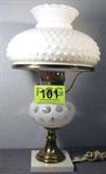 Fenton Coin Dot Glass White Opalescent Lamp
A beautiful vintage Fenton style Coin Dot White Opalescent glass and brass table lamp on a marble base with a white milk glass hob nail style shade. The gorgeous coin dot pattern also shows the natural swirls in the glass. The marble base has a small chip in it. Measures 18.5" tall with an 11" diameter.