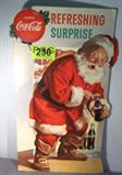Coca-Cola Cardboard Advertising Sign w/ Santa
A great vintage Coca-Cola cardboard lithograph advertising sign. Santa has been caught in the act of opening up a bottle of Coke for a "Refreshing Surprise". Stand up cardboard sign measures 27" x 14.5". There are a couple of small scratches on the sign and the bottom edges have small bends in them.
