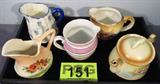 Mixed Lot Czechoslovakian Pottery & Glass
Mixed lot of decorative items all made in Czechoslovakia:
- Pretty cream pitcher decorated with roses. Measures 3" tall. Gold trim is worn due to age and use.
- Small teapot pitcher with lid decorated with a floral pattern. Measures 3.5" tall. Gold trim is word due to age and use.
- Small pink and black luster ware striped pitcher is 3.75" tall. No chips, cracks or breaks.
- Small white pitcher decorated with bachelor button type flower designs and a blue handle. Measures 3.75" tall. No chips, cracks or breaks.
- Small pink and green vase decorated with flowers. Measures 4" tall. Has a very small chip on the rim.