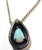 Jewelry 14kt Yellow Gold Opal Pendant Necklace
Lovely 14kt yellow gold chain necklace with tear drop shaped pendant featuring an opal stone and a small diamond. Measures: 17" long, marked "14k". Total weight: 2.8 dwt.