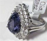 Jewelry 14KT White Gold Diamond & Tanzanite Ring
Breathtaking14KT white gold Tanzanite & diamond ladies ring fitting a finger size 6.75. Included AIG (American International Gemologists) Report reads:
"One electronically tested 14KT white gold ladies cast Tanzanite & diamond ring with a bright finish. Condition is new, good workmanship. The featured Tanzanite is set within a multi-tiered diamond bezel, completed by a three millimeter wide band. Identified with markings of '14K'. Containing:
One prong set pear brilliant cut natural Tanzanite, measuring 14.50 x 10.20 x 8.00mm, approximate weight of 8.51ct., clarity is eye clean, type I, medium dark, grayish, violetish blue color, (GIA vB 6/1) to medium, slightly grayish, bluish purple, (GIA bP 5/2), cut is good. Transmitting light with no distortion, transparent. Colored Stone Grading Report attached. Graded in setting.
Tanzanite is a very rare gemstone that is only found in the country of Tanzania. Originally discovered in 1967. Tiffa