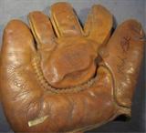 Babe Ruth Autographed Baseball Mitt ACE
An authentic hand signed Babe Ruth baseball mitt / glove. The glove is made by Gold Smith products. Signature is certified by Autograph Certification Experts, LLC, Justin Chris Priddy, President. Certification # B36936 can be verified at www.autographcertificationexperts.com.
George Herman Ruth, Jr. (February 6, 1895 – August 16, 1948), best known as "Babe" Ruth and nicknamed "the Bambino" and "the Sultan of Swat", was an American Major League baseball player from 1914–1935. Ruth originally broke into the major leagues with the Boston Red Sox as a starting pitcher, but after he was sold to the New York Yankees in 1919, he converted to a full-time right fielder and subsequently became one of the league's most prolific hitters. Ruth was a mainstay in the Yankees' lineup that won seven pennants and four World Series titles during his tenure with the team. After a short stint with the Boston Braves in 1935, Ruth retired. In 1936, Ruth became one of