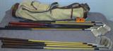Vintage Golf Clubs & Bag Spalding / Wilson
A great lot for any golf enthusiast. These right handed golf clubs are in a vintage leather trimmed cloth bag. Clubs include:
- 3, 4 and 5 iron Wilson Walker Cup series clubs.
- Patty Berg 3 iron, Wilson Reg No. 27370.
- Walter Hagen Star-Line, 5 and 8 iron.
- Spalding Autograph series, Robert Jones Jr., 4, 5, 7, 9 and an unmarked iron, all have wood shafts.
- There are a few vintage wooden tees in one of the pockets on the bag