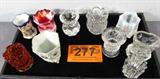 Lot of 10 Miniature Glass Vases Toothpick Holders
A beautiful mixed lot of miniature glass vases. Some of them could be suitable to use as toothpick holders. Lot includes:
- Opalescent glass with peach color iris decorations. Unmarked. Measures 2" tall.
- Amberina style glass vase with scalloped edge top. Measures 2.5" tall.
- White vase with painted Japanese scenery and women. Marked "Japan". Measures 2.5" tall.
- Pressed glass with corn ear design. There are a few very small chips and cracks on this piece. Unmarked. Measures 2.5" tall.
- A very pretty cut glass vase, possibly crystal, with an etched flower design on either side. Measures 3" tall.
- A beautiful vase with red, orange and white swirls, end of day or slag glass. Measures 2.5" tall.
- More.