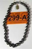 Jewelry Black Tahitian Cultured Pearl Necklace
Beautiful & elegant Tahitian cultured pearl necklace. Included AIG Gem & Jewelry Report reads:
"One graduated single strand pearl necklace seventeen inch princess length, knotted with a 14KT white gold twelve millimeter plunger style clasp containing thirty-five Tahitian cultured pearls, 10.00mm to 13.00mm in size. The pearls are black to brownish black in color, exhibiting orient with high luster, thck nacre, mostly round, lightly spotted, with good uniformity.
Tahitian cultured pearls form in the large "Black Lipped" Pinctada Margaritifera, oyster which is about twice the size of the Japanese Akoya oyster. This warm water species from across the central and South Pacific Ocean is at home in the bays and lagoons of the islands and atolls of French Polynesia. Tahitian cultured pearl farmers generally raise their oysters in lagoons.
Tahitian cultured pearls take from two to four years to form. Tahitian cultured pearls are known for their