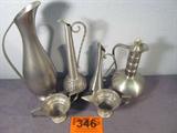 Mixed Lot Pewter Pitchers Royal Holland Selandia +
A great mixed lot of pewter pitchers / vases:
- A very pretty lidded pitcher made by Haugrad Pewter in Norway. Measures approximately 8" tall.
- A beautiful flowing shaped pitcher made by Royal Holland Daalderop Pewter. Measures 11.75" tall.
- A nice pitcher / vase made by Selandia Petwer in Norway. Measures 10" tall.
- A lovely vase with a Merlion symbol on one side. The Merlion is a mythical creature with the head of a lion and the body of a fish, used as a mascot of Singapore. The pitcher is made by Far East Pewter. Measures approximately 7.5" tall. Base is bent.
- A metal set, possibly pewter, cream and sugar servers. Each measures 2.5" tall.