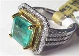 Jewelry 18kt White Gold Diamond & Emerald Ring
Stunning 18kt white gold Emerald and diamond ring, size: 7. Included AIG Pre-sale Estimated Retail & Gemological report reads: "One electronically tested 22kt yellow gold and 18kt white gold ladies cast and assembled emerald and diamond ring. Condition is new, good workmanship. The featured emerald is mounted in a 22kt yellow wold basket and diamond bezel and outer 18kt white gold diamond lattice gallery, supported by diamond set shoulders and complete by a four millimeter wide band. Identified with markings of "750 22k". Containing:
One prong set square step cut natural emerald, measuring 9.10 x 9.00 x 5.90mm, approximate weight of 3.44 ct. Clarity is moderately included, type III, medium, moderately strong, very slightly bluish green color, (GIA vslbG 5/4), cut is good. Transmitting light with a minimum distortion, transparent. Naturally occurring internal & external characteristics are present. Indications of oil residue. Graded in the