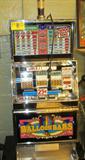 Las Vegas Slot Machine W/ Stand Balloon Bars
A genuine Las Vegas Slot Machine by IGT with commercial stand. Quarter payout machine takes quarters to play. Machine is not working but powers up. Unknown problem. Consignor stated that it worked prior to bringing to auction. Appears complete. Slot Machine is 48" Tall x 22" across and 19" deep. Stand is 22" tall x 16" deep and 27" wide.