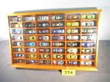 NASCAR Wooden Display Case w/ 48 Die Cast Cars
This wonderful adult collectible NASCAR collection features 48 authentically scaled die-cast replica cars in a very nice wooden display case with a plexiglass front. Various manufacturers include Hot Wheels, Racing Champions and Action Performance. Cars are dated in the 1990's and early 2000s. Sponsor logos include Snickers, SquareD, U.S. Army, Kodak, Gillette, and Coors Light. A few of the Cars included in this lot are NASCAR numbers 01, 4, 7, 36, 55, and 88.
