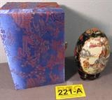 Vintage Oriental Hand Painted Porcelain Egg
An amazing Oriental porcelain egg that appears to be hand painted. Scene features a Mother supervising her two young children at play. The bold colors are accented with gold trim. Includes a small wooden stand for display. These items are presented in a silk box. Measures 6" tall with a 4.5" diameter.