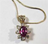 Jewelry 18KT. Gold Ruby & Diamond Necklace
A beautiful 18kt Gold Ruby & Diamond Pendant with 18kt gold Chain. Comes with an appraisal from Hall Jewellers. Appraisal states: Ladies 18kt yellow gold Ruby and Diamond Pendant. Designed with one oval faceted genuine Ruby-Corundum measuring approximately 5x3 of fine color. There are 8 brilliant cut Diamonds with a total weight of .10cts of very good color, cut and clarity.