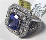 Jewelry 14kt White Gold Tanzanite & Diamond Ring
Fabulous 14kt white gold Tanzanite and Diamond ring. Size: 7.25.
Included AIG Pre-Sale Estimated Retail & Gemological report reads:
"One electronically tested 14kt white gold ladies cast Tanzanite and diamond ring. The featured Tanzanite is set within a tiered diamond frame, supported by diamond set shoulders with open filigree and completed by a three millimeter wide band. Bright polish finish with a milgrain detail throughout. Identified with markings of "14k". Containing:
One prong set rectangular cushion mixed cut natural Tanzanite, measuring 11.05 x 8.50 x 6.40mm, approximate weight of 4.46ct., clarity is eye clean, type 1, medium dark, very slightly grayish, bluish violet color, (GIA bV 6/3) to medium dark, very slightly grayish, bluish purple, (GIA bP 6/3), cut is good. Transmitting light with no distortion, transparent. Naturally occurring internal and external characteristics are present. Graded in the setting.
Tanzanite is a v