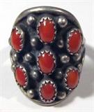 Jewelry Sterling Silver Red Coral Cluster Ring
Beautiful sterling silver ring with Southwestern style design. Featuring 6 sawtooth set polished red coral pieces. Unmarked, appears to be sterling. Ring size: 10.75, total weight: .31 ozt.