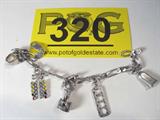 Jewelry Sterling Silver Charm Bracelet
Adorable sterling silver charm bracelet with several charms that appear to be racing / BMX themed:
- All silver full faced motorcycle helmet
- A bell shaped charm marked / signed "CC"
- More!
Bracelet terminates at a lobster claw clasp marked / signed "925", measures 7.75" long (est).
Total weight: 0.84 ozt