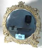 Vintage Cast Metal Free Standing Vanity Mirror
A beautiful free standing vanity mirror. The beveled glass mirror has an ornate metal frame decorated with angel and cherub figures Measures 16" in diameter.