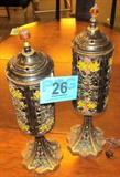 Pair of Victorian Style Cast Metal Parlor Lamp
A beautiful pair of painted cast metal Victorian style parlor / table lamps with filigree shades. Wonderfully styled electric lamps have a solid base and filigree design shade with molded flower designs that have been painted in pastel colors. Tops lift off to remove / replace bulb. An amber glass finial adds an elegant finishing touch. Each lamp measures approximately 17.5" tall.
