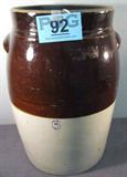 Vintage Two Tone #6 Stoneware Crock
A vintage two tone stoneware crock with small ear-like handles. Gray and brown jug is not dated. The number "6" is stamped on one side. Jug has a few minor chips. Measures approximately 17" tall with a 10.5" diameter top opening. No lid.