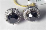 Jewelry 14kt Gold Black & White Diamond Earrings
Gorgeous 14kt white gold earrings featuring black and white diamond stones. Included AIG Pre-Sale Estimated Retail & Gemological Report reads: "One pair electronically tested 14kt white gold ladies cast & assembled black and white diamond ring. Bright polish finish. Containing:
Two prong set round brilliant cut diamonds, measuring 8.00 - 8.00 x 5.60mm (depth est.) 8.00% GTCF approximate total weight of 2 stones = 5.44ct. Indications of multiple laboratory enhancements. Graded in the setting.
Clarity: Declasse
Color: Fancy Black; Irradiated
Forty-Four prong set round brilliant cut diamonds, measuring 1.40 - 1.30 x .81mm (depth est.) approximate total weight of 44 stones = 0.46ct. Graded in the setting.
Clarity: I-1 to I-2
Color: H-I
Total weight of Diamonds: 5.90ct.
Total weight of Ring: 5.40gm."
Although the report states this item is a ring it is actually a pair of earrings, the picture in the report shows earrings as well, it app
