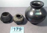 Lot of 3 Southwestern Style Black Pottery Pieces
Lot of 3 southwestern style black pottery pieces. Lot includes:
- An unsigned vase / bowl with a glossy black finish. Paper label on bottom indicates it was made in Mexico, appears to be Oxaca pottery. Measures 5.75" tall x 6" in diameter.
- A small unsigned smooth black finish vase / bowl. Measures 2.5" tall x 3.5" in diameter.
- A small unsigned etched vase that is black in color. Measures 2.5" tall x 3.5" in diameter.
