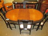 Furniture Oriental Style Oval Dining Table 4 Chair
A fantastic Oriental style oval four legged dining table with 4 chairs and 2 large extension leaves. Table top appears to be natural burl wood with an elegant black painted border. Chairs are painted black and have an etched design on the single slat back. Chair cushions are upholstered in a light pink cotton material. Wood on table and chairs have a few scratches from normal wear and use. Lot includes two large 38" x 18" extensions. Table measures 48" in length, 38" across, and is 30" in height. Chairs are approximately 40" in height, 19" across, and 17.5" in depth.