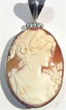 Jewelry Sterling Silver Carved Shell Cameo Pendant
Gorgeous cameo pendant in sterling silver bezel, measures: 2.25" long. Cameo has amazing detail!
Total weight: .53 ozt