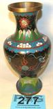 Oriental Style Cloisonne Vase w/ Dragons
An oriental style Cloisonne vase. Beautiful decoration features a beautiful floral pattern and two dragons. Vase measures approximately 9" tall.
Z14
