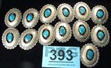 Jewelry Concho Belt Adornments Sterling Turquoise
Beautiful lot of twelve Concho belt adornments & one concho belt buckle. Each adornment is an oval shadow box housing a medium sized rich cerulean blue turquoise stone with naturally occurring dark color variations throughout, in a saw tooth setting with engravings & rope designs lining the edge of the silver shadow box. Each is signed "W.", measuring 2.25" x 2".
Total weight of 13 pieces: 9.43 ozt