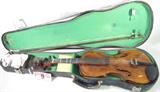 Antique HOPF Violin, Bow, & Case
This lot includes an antique violin, stamped in block letters on the back "HOPF". A handwritten note on the inside of the instrument states, "First purchased in 1911 by Charles Robert Brumb". There are a few scratches in the finish and it is well worn in places. Blue tape has been used on the neck to mark the keys. The felt lined plastic case shows a lot of wear and tear from age and use
